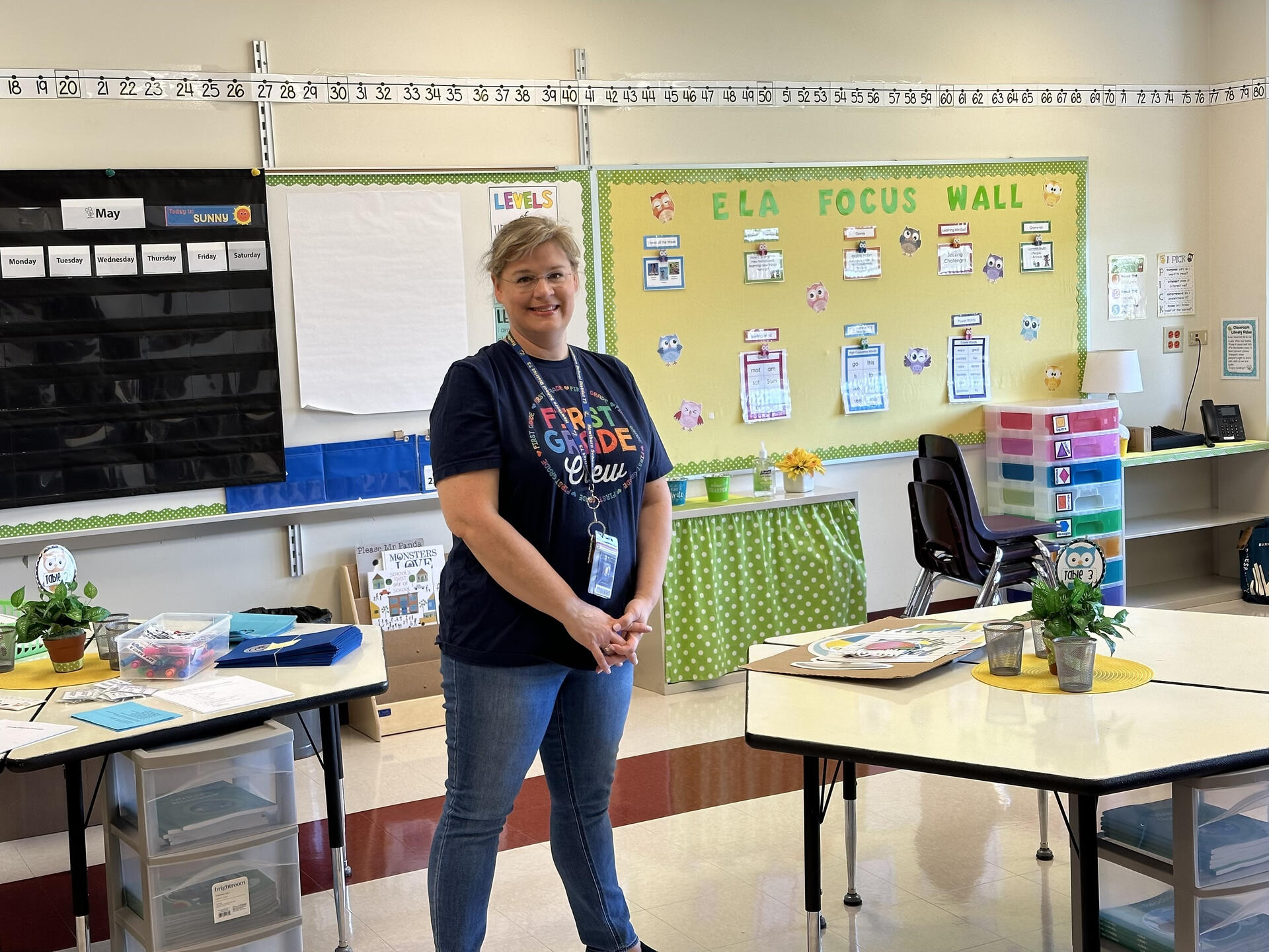 Jennifer standing in her first grade classroom in 2023